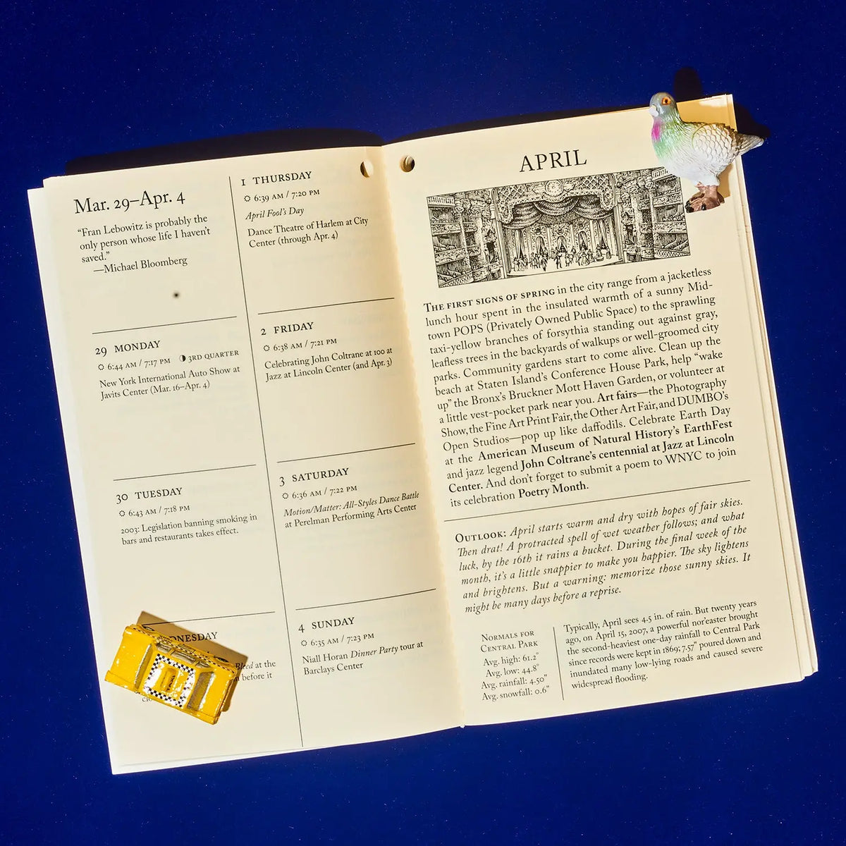 A vintage-style paper program or booklet laid flat on a dark blue background, with printed text, dates, a small map, and a gold foil stamp attached near the bottom left corner.