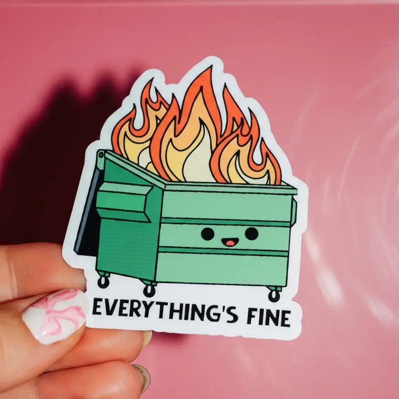 Sticker of a flaming dumpster with 'Everything's Fine' text held against a pink background
