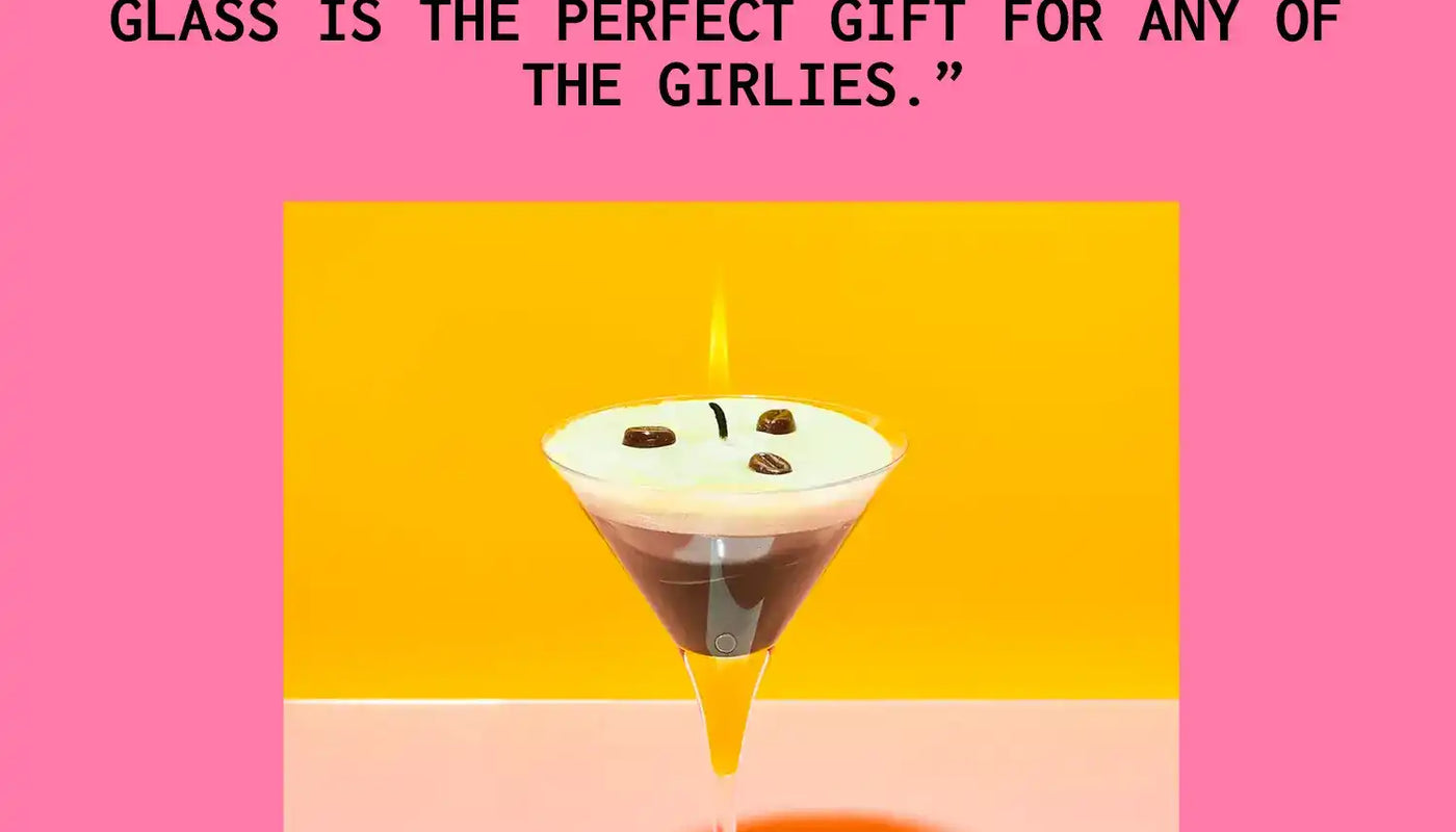 Espresso martini candle in a martini glass with decorative coffee beans on top.