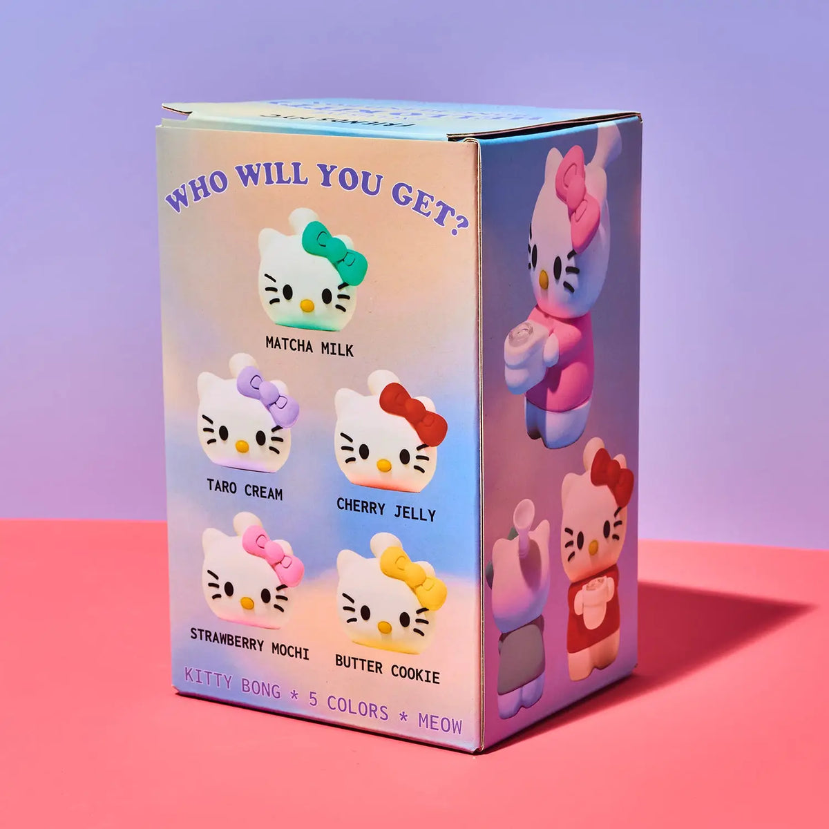 A boxed blind box product featuring Hello Kitty character artwork and text reading 'WHO WILL YOU GET?' with flavor options Matcha Milk, Taro Cream, Cherry Jelly, Strawberry Mochi, and Butter Cookie. The box is photographed on a pink surface against a lavender-to-pink gradient studio background.