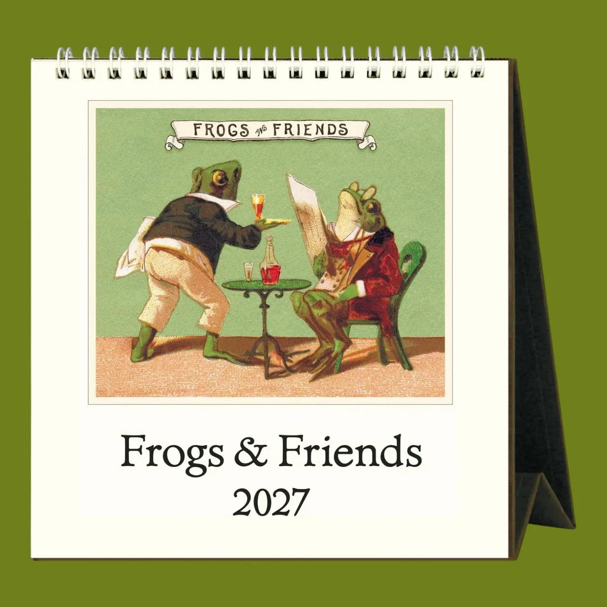 A spiral-bound desk calendar shown standing upright on a solid olive green background. The front cover features a vintage-style illustration of two frogs at a small table, with the title 'FROGS & FRIENDS' above and 'Frogs & Friends 2027' below.