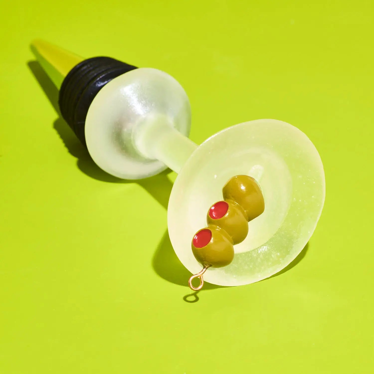 Wine bottle stopper with olives on a green background