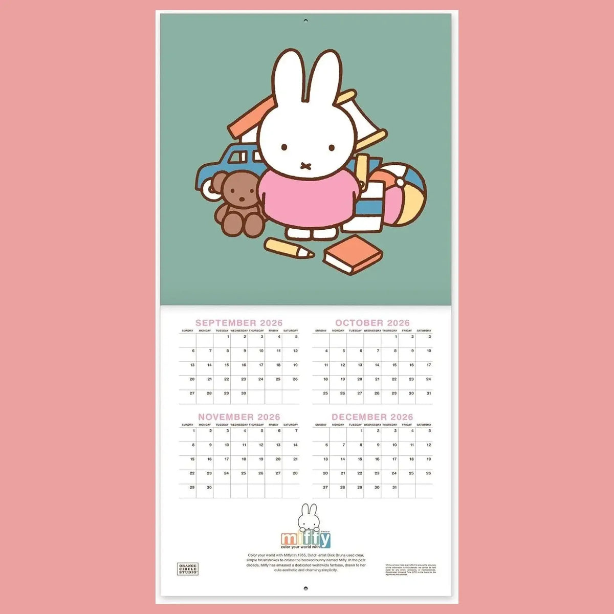 A vertical wall calendar page featuring a cute cartoon rabbit character surrounded by toys on a muted green upper section, with monthly grids for September through December 2026 below on a white page. The calendar is centered against a solid pink background.