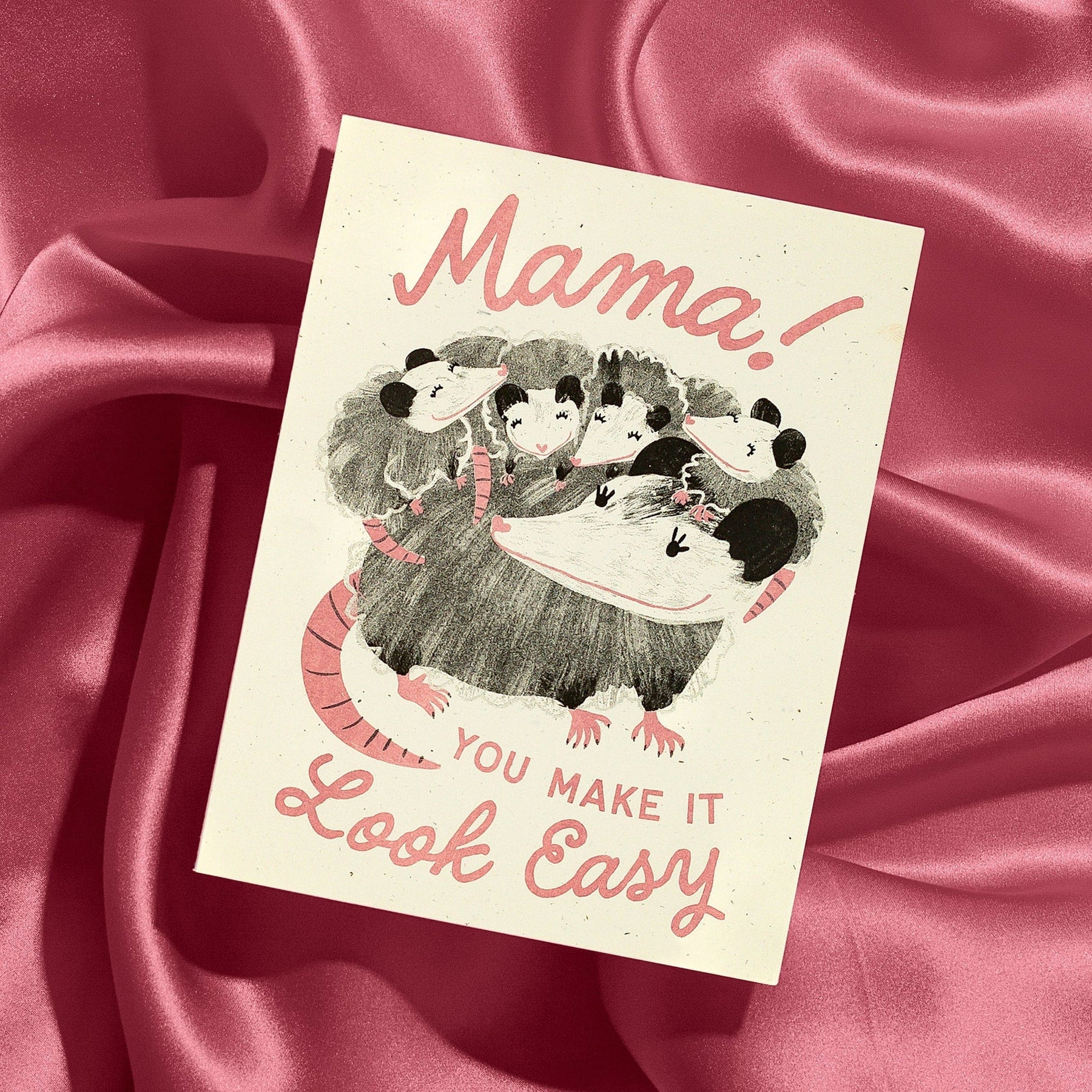 Card with illustration of a mother opossum and her children on a pink satin background with the message "you make it look easy"