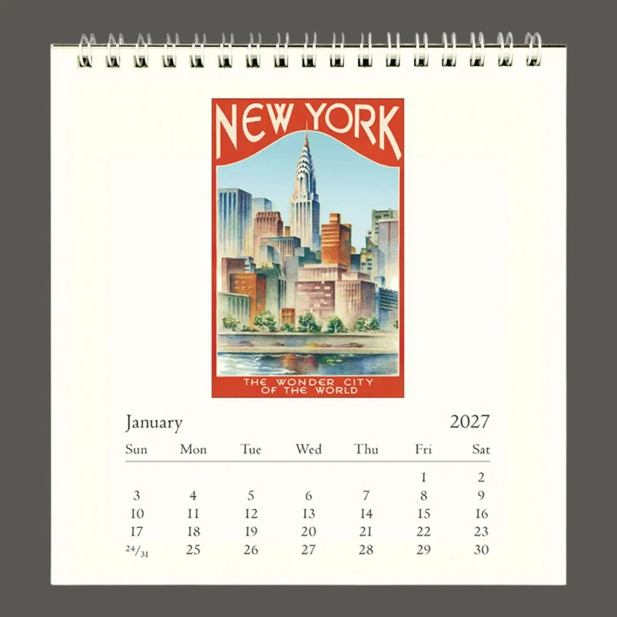 A spiral-bound 2027 calendar page featuring a vintage-style New York City skyline illustration with the words 'NEW YORK' and 'THE WORLD'S CITY OF THE WORLD' on the cover area.