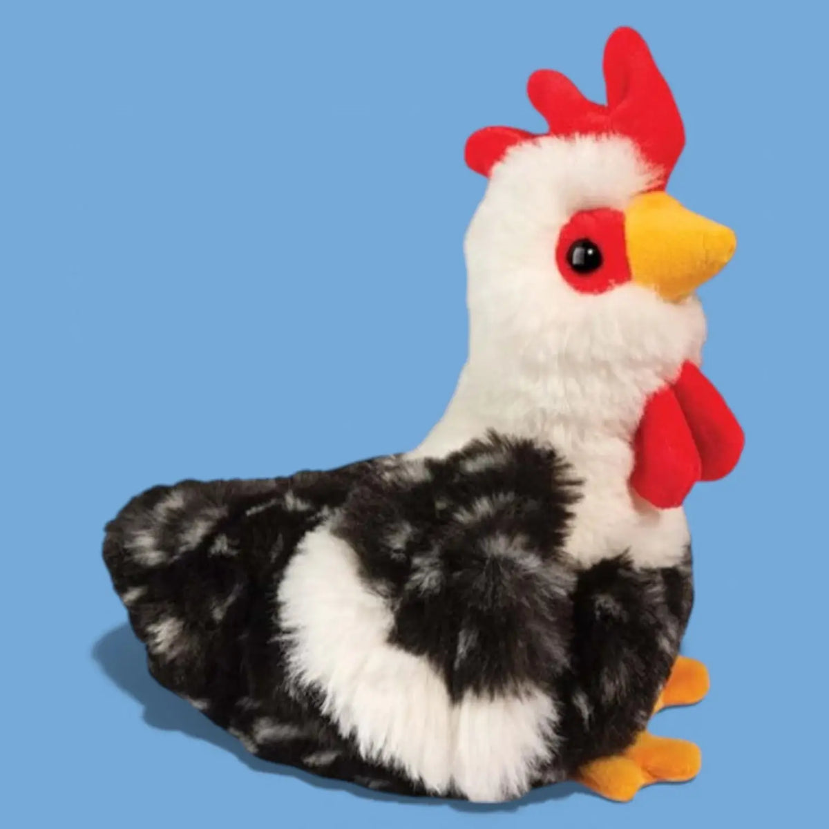 Plush toy rooster with black, white, and red feathers on a blue background