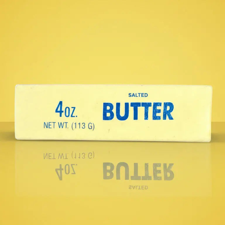 Butter stress toy package with yellow label on a blue background
