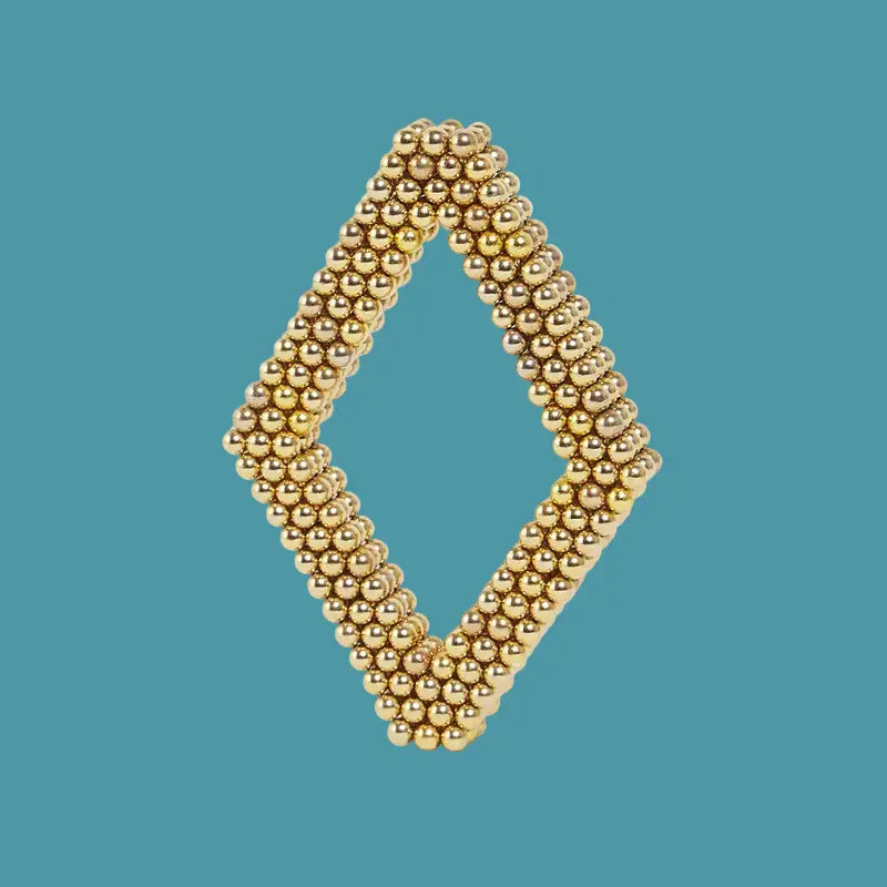 Gold beaded diamond-shaped object