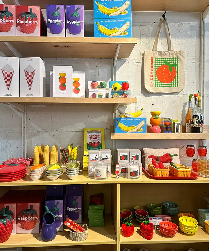 Friends NYC Brooklyn store display of brightly colored fruit and vegetable themed fake food home decor items