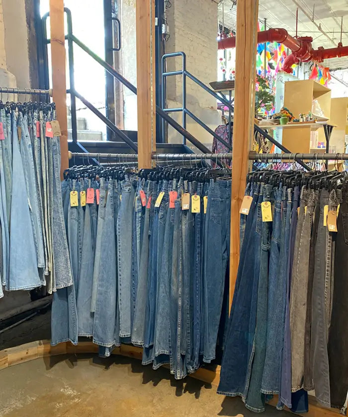 Friends NYC Brooklyn Vintage Clothing featuring a rack of denim jeans