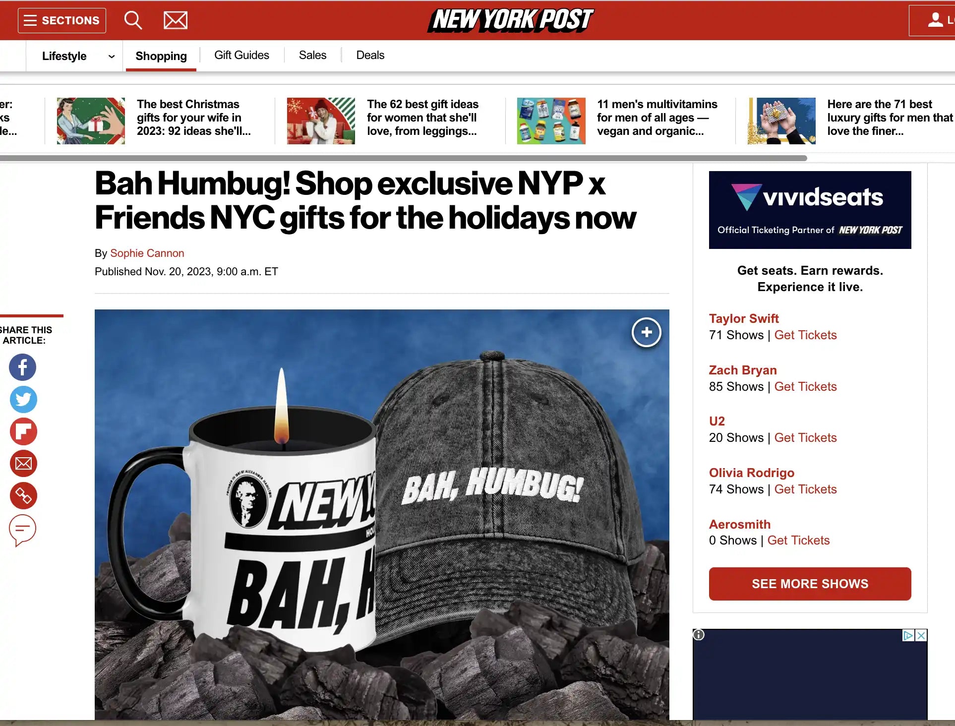 A black baseball cap and white coffee mug with ’Bah Humbug’ text displayed on them.