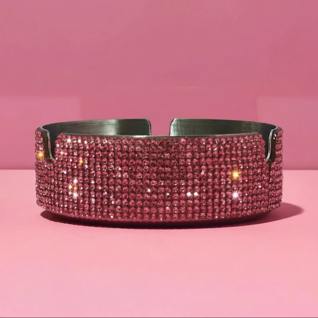 Pink rhinestone ashtray on a pink background