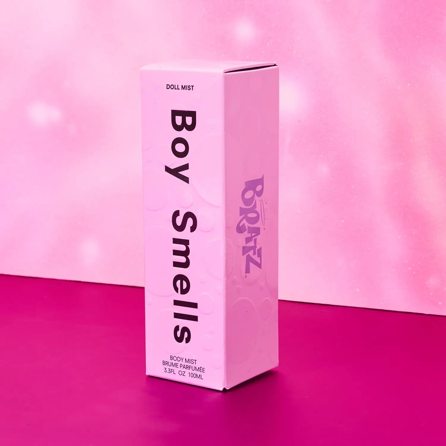 Pink 'Boy Smells' product packaging on a pink background