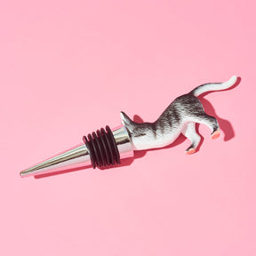 Cat-shaped bottle stopper on a pink background