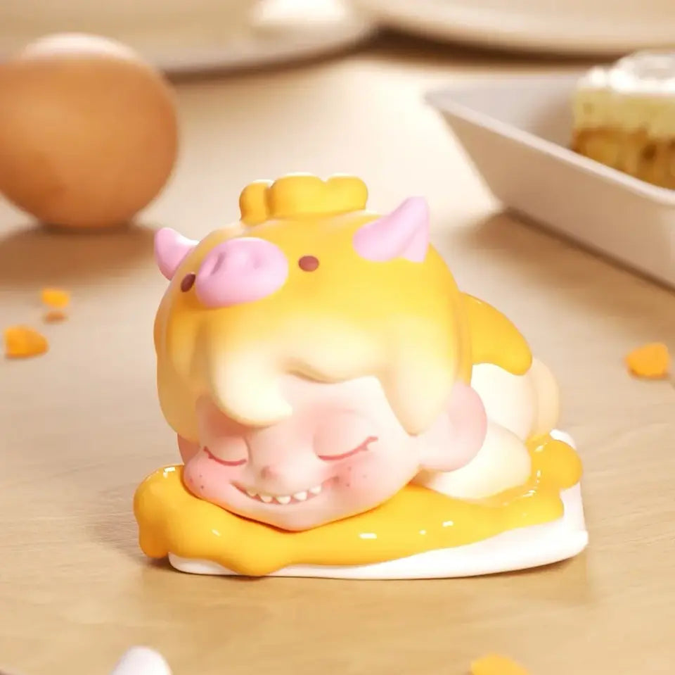 Cute cartoon-style pig figurine on a wooden surface with blurred background