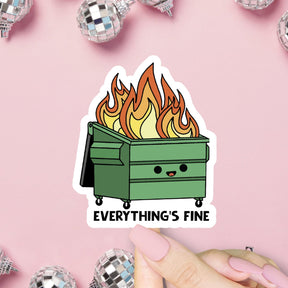 Sticker of a flaming green dumpster with 'Everything's Fine' text on a pink background with disco balls.