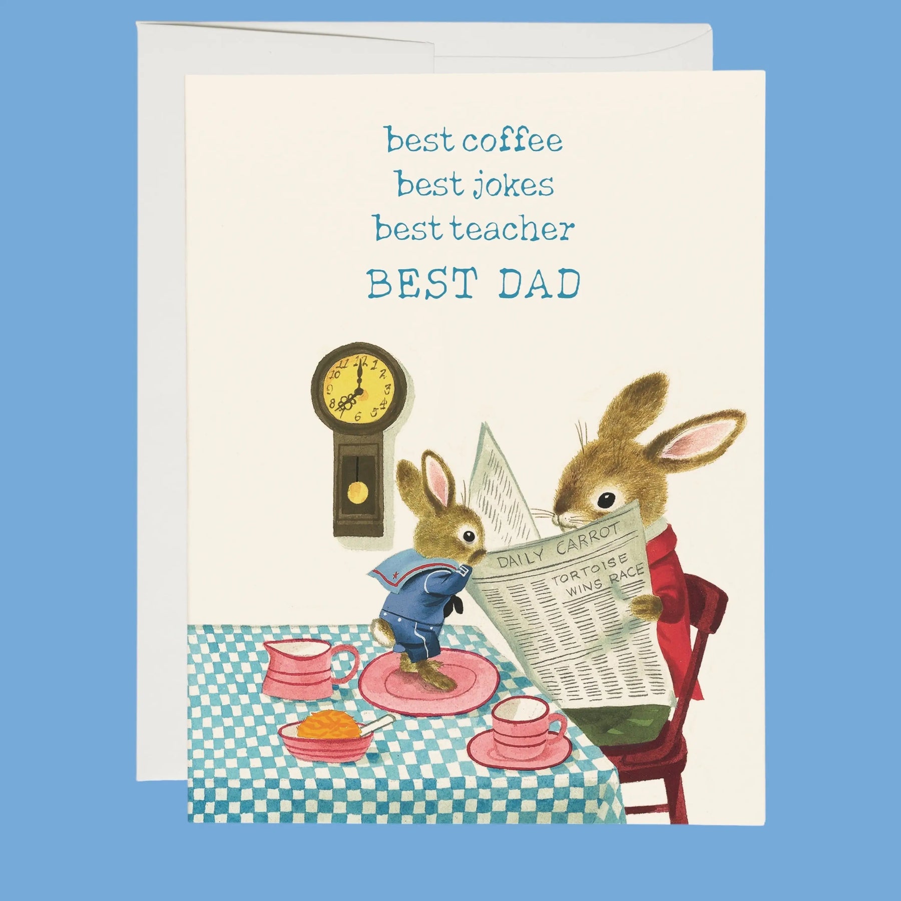 Greeting card with two bunnies at a table, one reading a newspaper and the other looking at a clock, with text 'best coffee, best jokes, best teacher, BEST DAD' on a blue background.