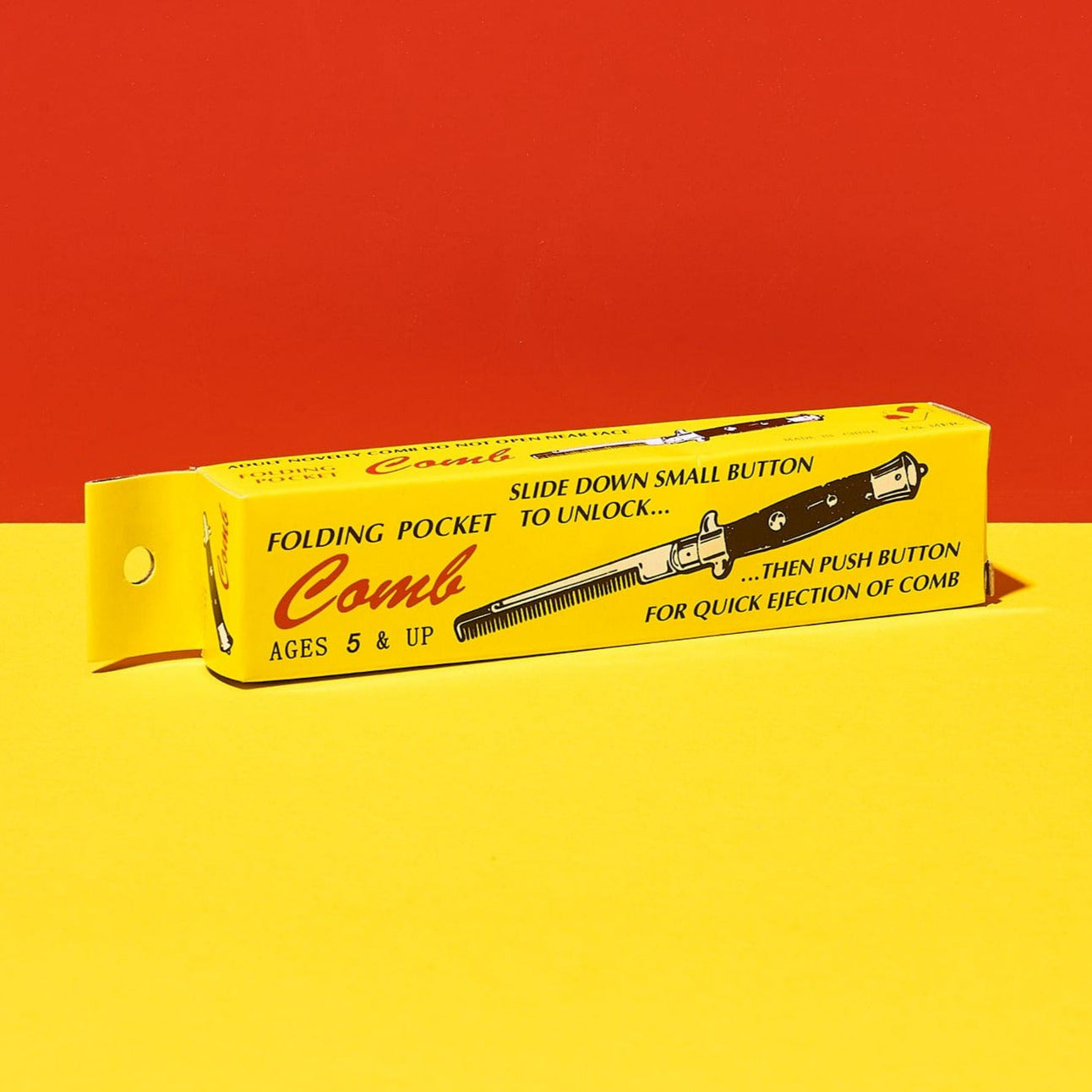 Faux Switchblade Folding Pocket Comb | Gifts at Friends NYC in