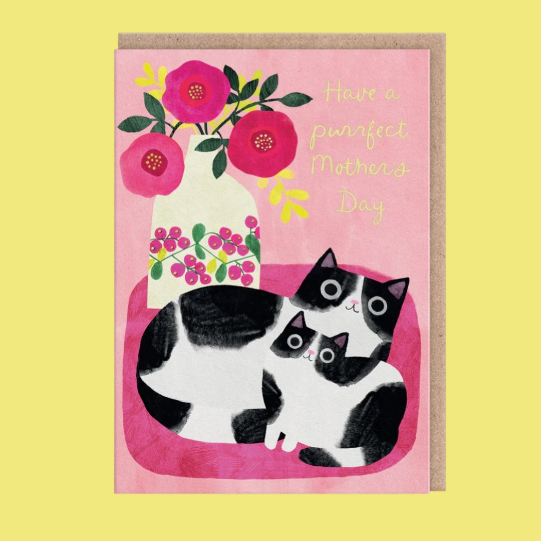 Greeting card with two cats and flowers on a pink background