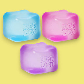 Three colorful ice cube-shaped objects with 'Nee Doh' branding on a yellow background