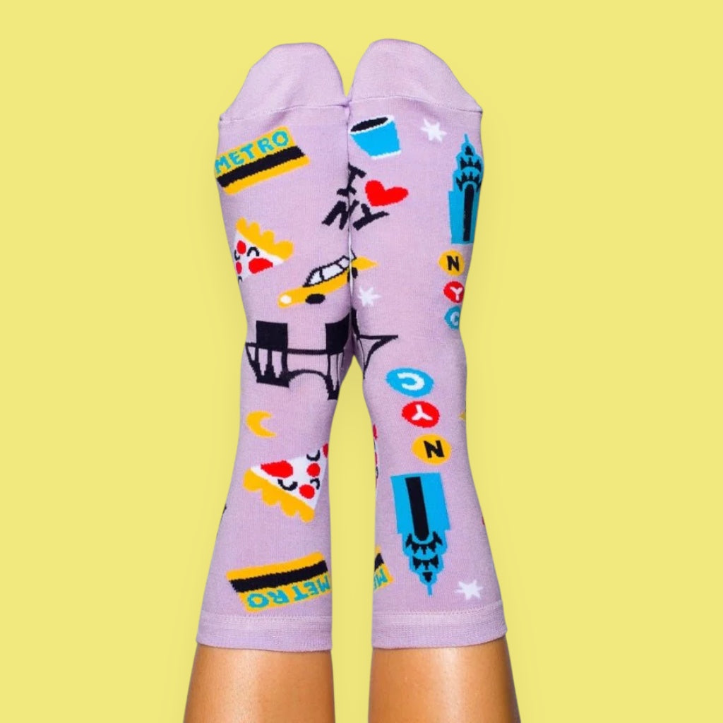 Colorful patterned socks on a yellow background