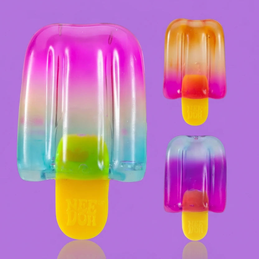 Colorful popsicle-shaped ice cream molds on a purple background