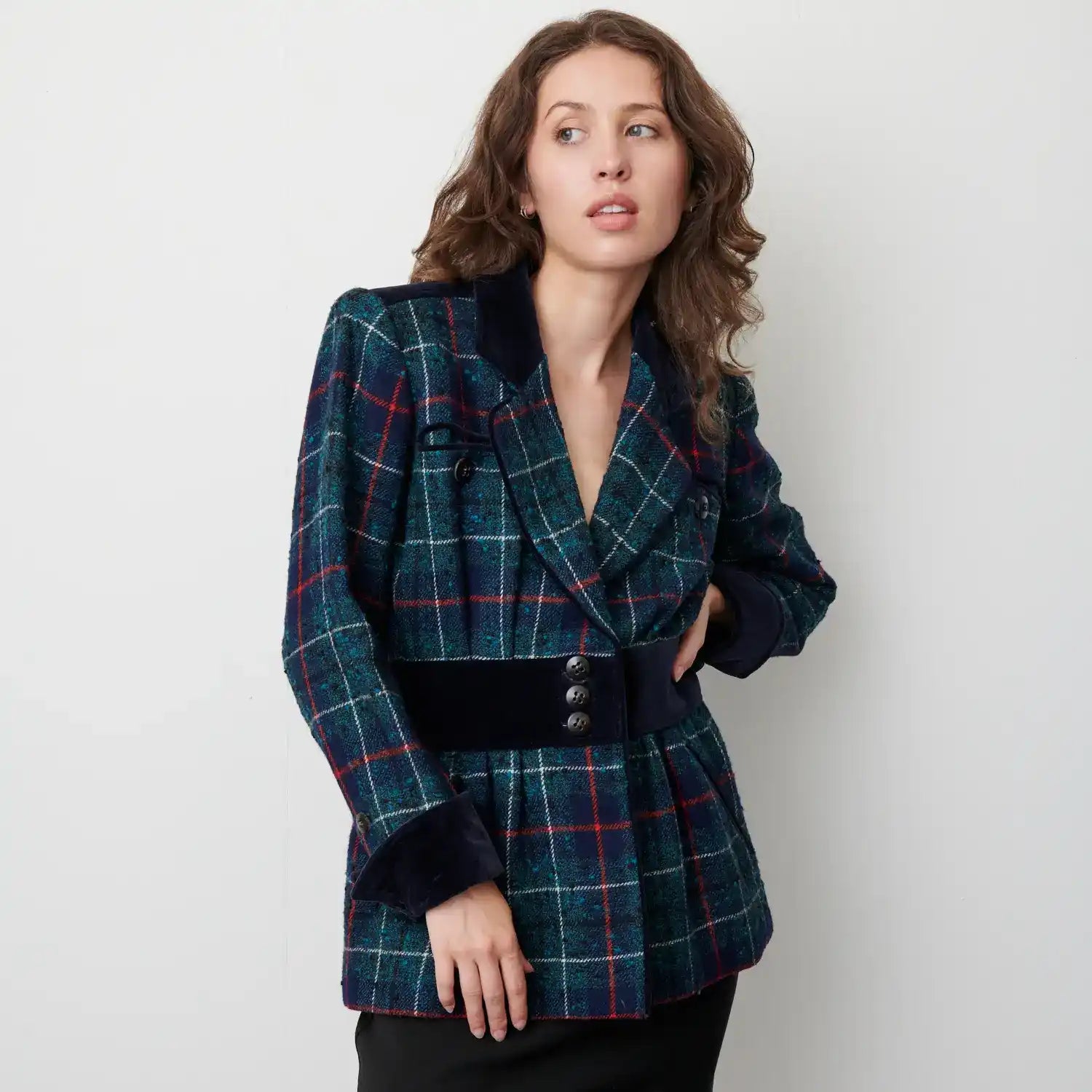 Plaid wool blazer with a black belt at the waist.