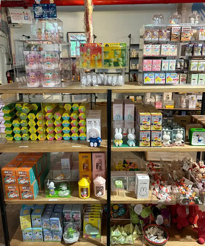 Retail display shelves stocked with colorful toys, drinks, and merchandise.