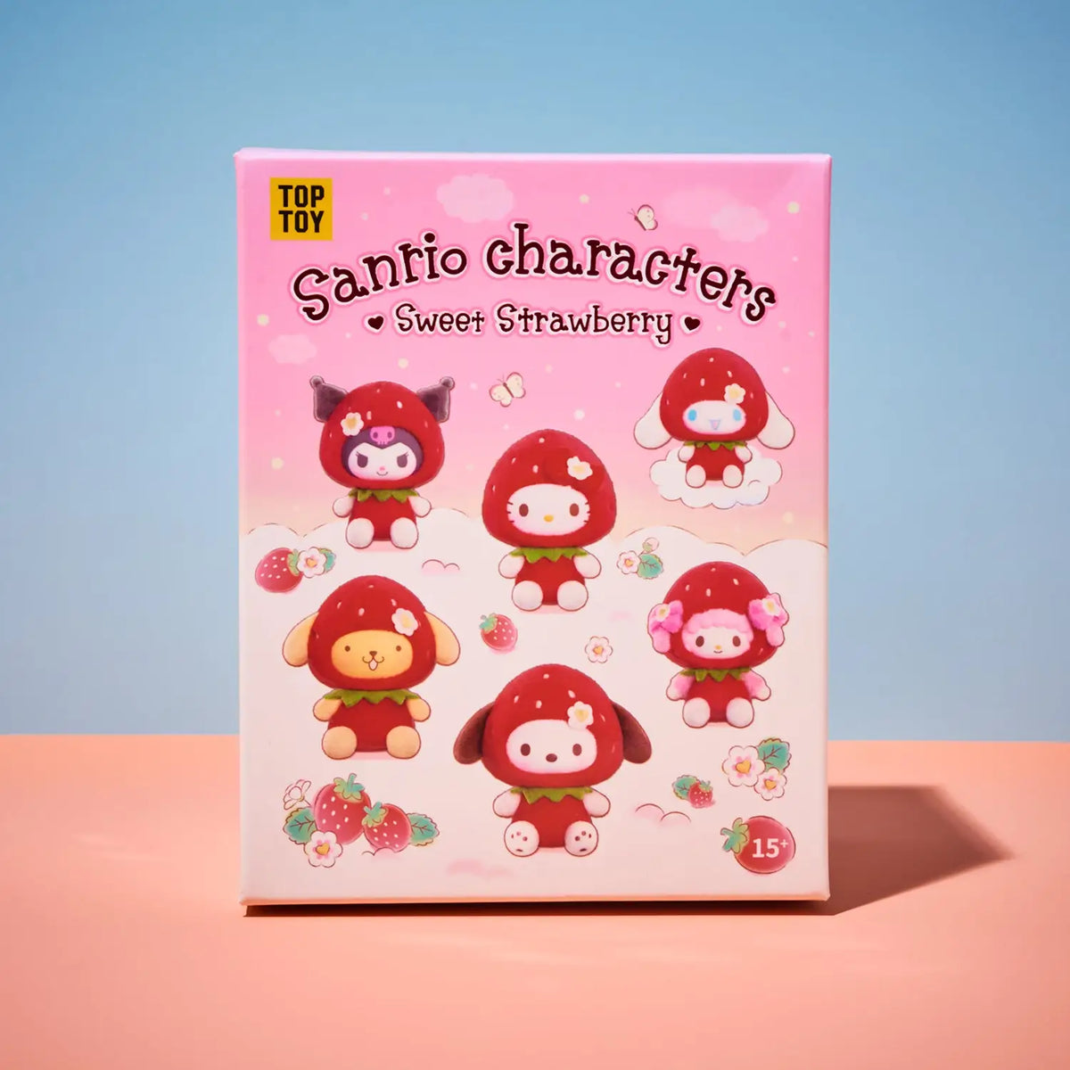 A pink product box for 'TOP TOY Santio characters Sweet Strawberry' blind box set, featuring cute strawberry-themed cartoon characters on the front, set against a split blue and pink background.