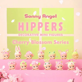 Sonny Angel Hippers Cherry Blossom Series packaging with decorative mini figures on a pink background.