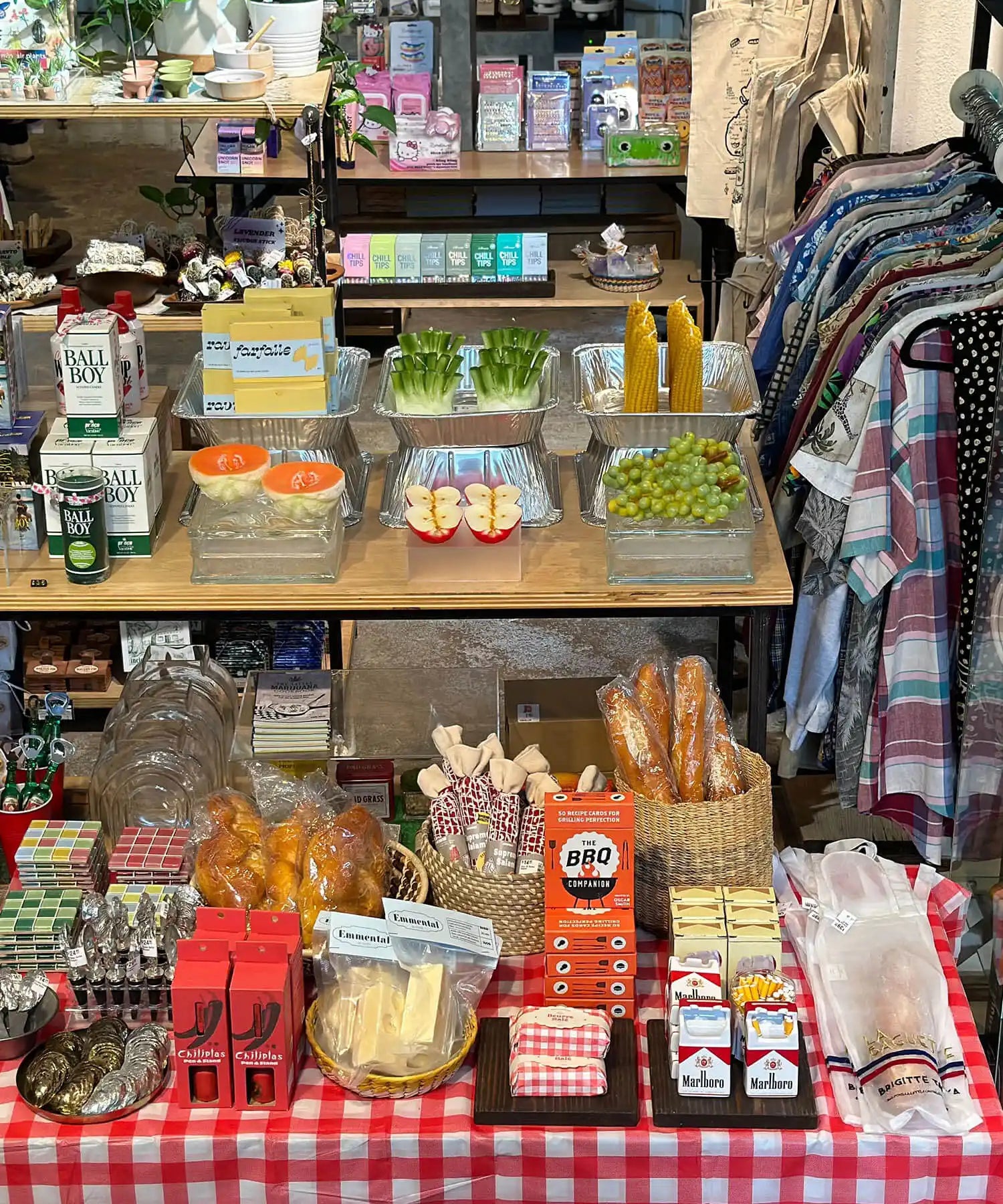 Store display shelf stocked with snacks, drinks, and packaged foods.