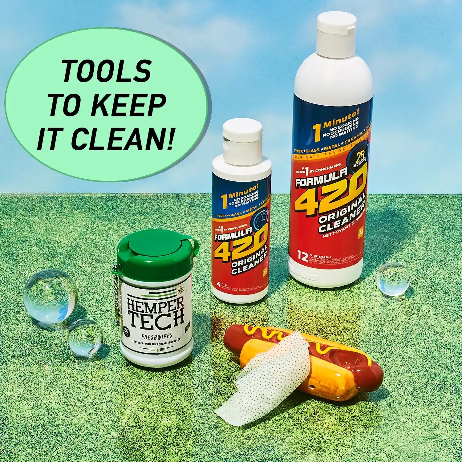 Cleaning supplies and products arranged with decorative glass beads and a toy hot dog.