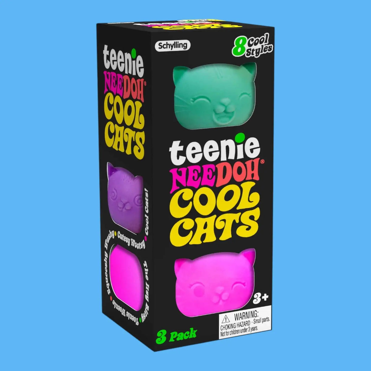 Box of Teenie Needoh Cool Cats toys with colorful packaging on a blue background