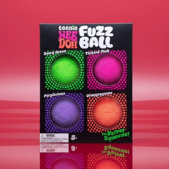 Packaging of Teenie Nee Fuzz Ball with colorful balls on a pink background