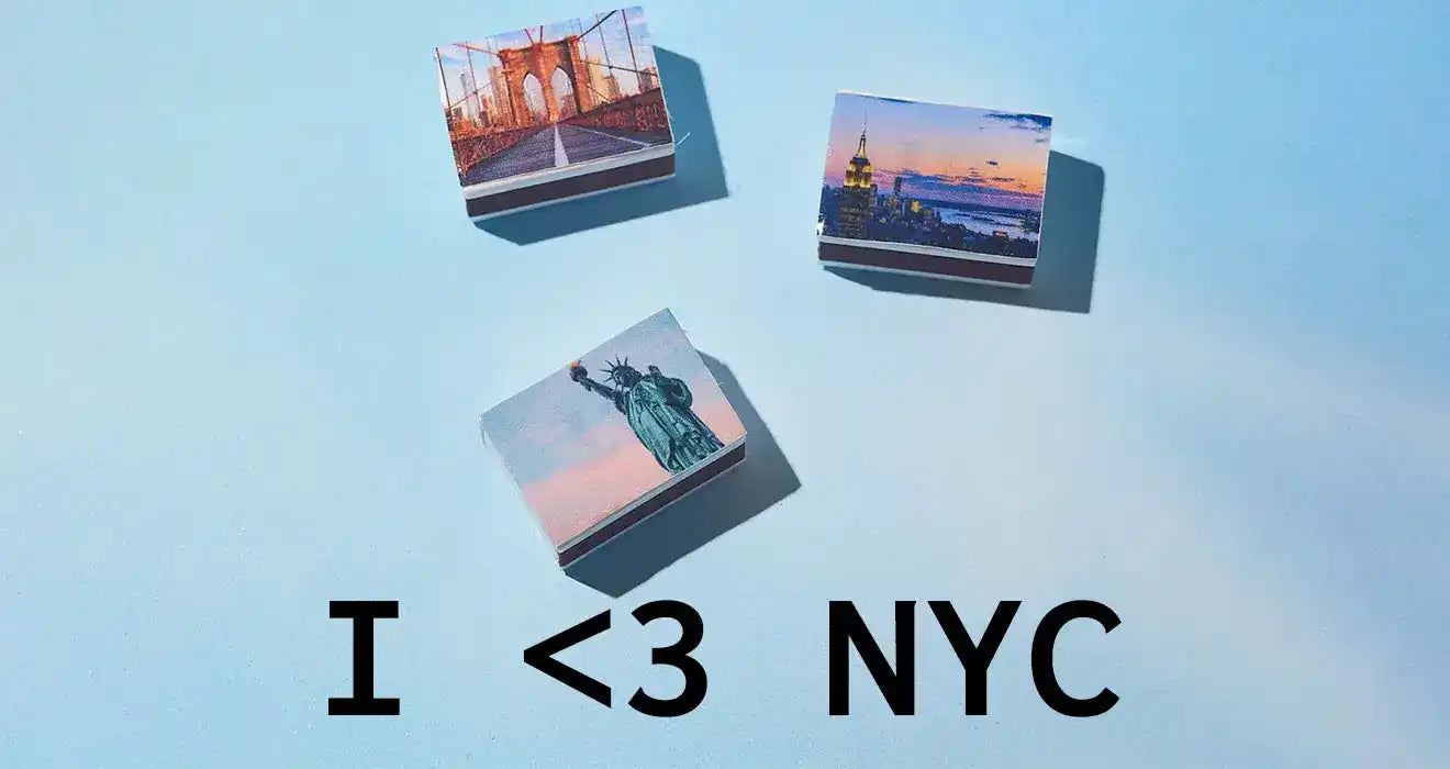 Text reading ’I <3 NYC’ with three floating polaroid-style photos above it.