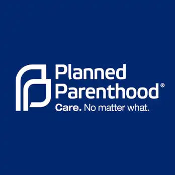 White Planned Parenthood logo with their tagline ’Care. No matter what.’ on a navy blue background.