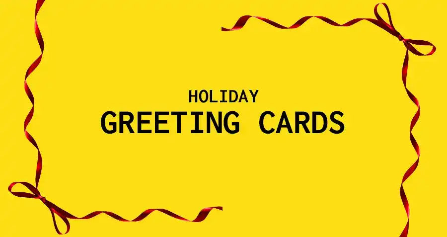 Yellow sign with ’HOLIDAY GREETING CARDS’ text framed by red ribbon decorations.